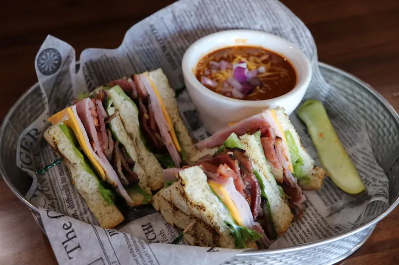 Stage Club sandwich is served with a small bowl of chili
