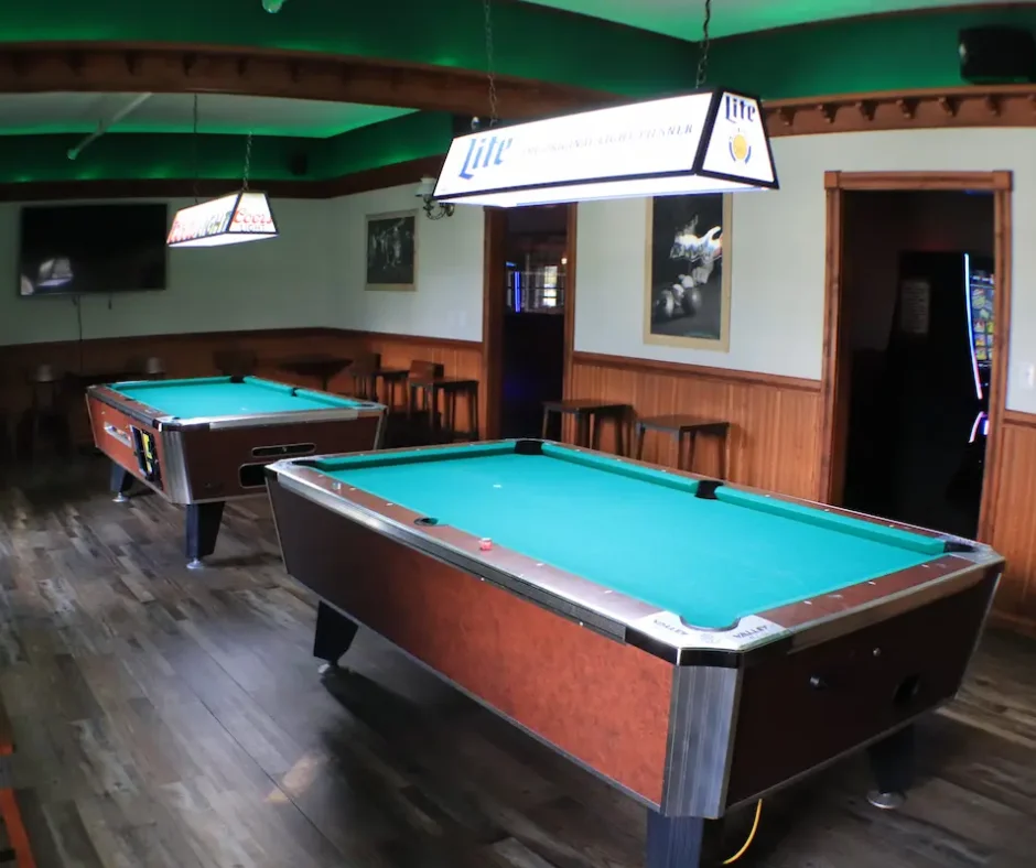 Upstairs game room at Stage Stop with two pool tables