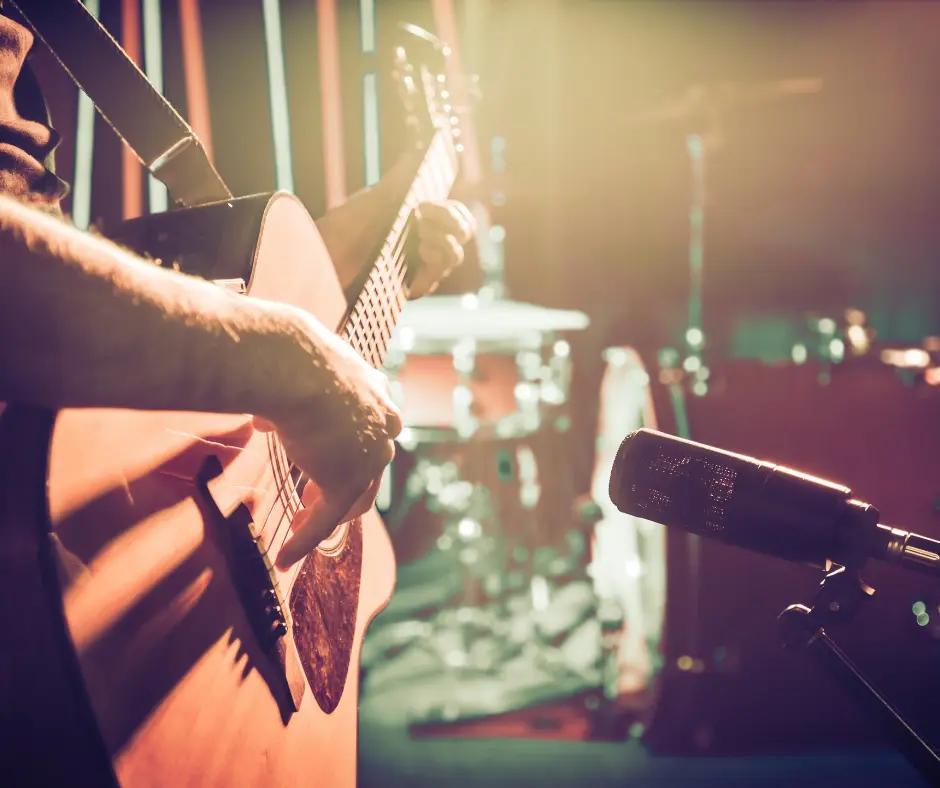 Closeup of person playing a guitar